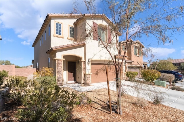 mediterranean / spanish-style home featuring a garage