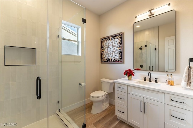 4796 Riva De Romanza St, Las Vegas, NV 89135 - full bathroom featuring vanity, wood finished floors, and a stall shower