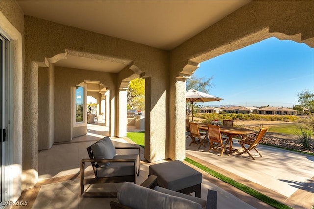 4796 Riva De Romanza St, Las Vegas, NV 89135 - view of patio / terrace with outdoor dining space and a residential view