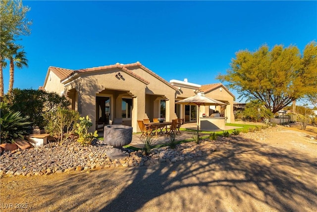 4796 Riva De Romanza St, Las Vegas, NV 89135 - mediterranean / spanish house featuring a patio area, stucco siding, a tiled roof, and a gazebo