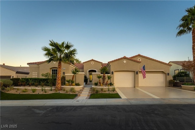 4796 Riva De Romanza St, Las Vegas, NV 89135 - mediterranean / spanish-style home with a garage, driveway, stucco siding, and a tiled roof