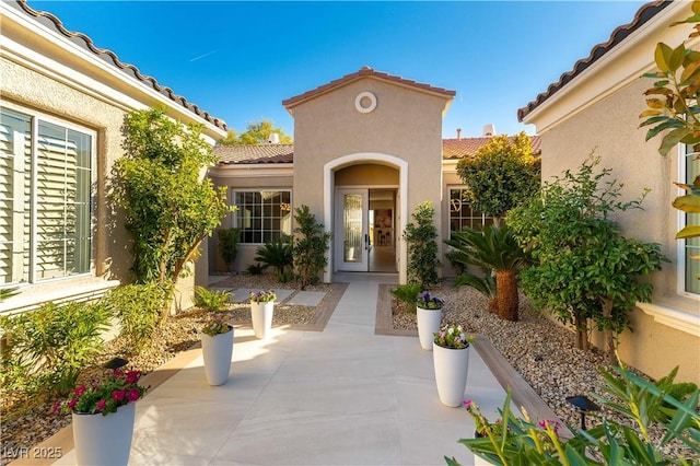 4796 Riva De Romanza St, Las Vegas, NV 89135 - property entrance featuring a tile roof and stucco siding