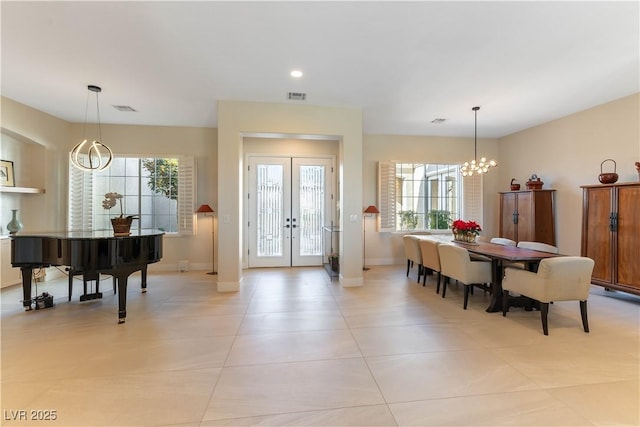 4796 Riva De Romanza St, Las Vegas, NV 89135 - dining space featuring a chandelier, french doors, light tile patterned flooring, and recessed lighting