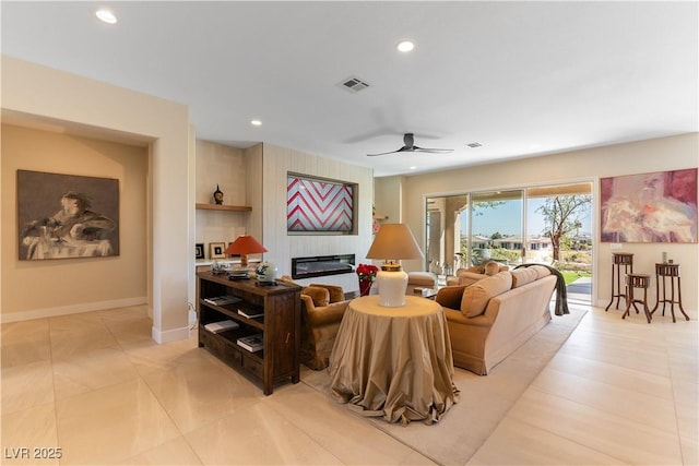 4796 Riva De Romanza St, Las Vegas, NV 89135 - living area with a ceiling fan, a glass covered fireplace, and recessed lighting