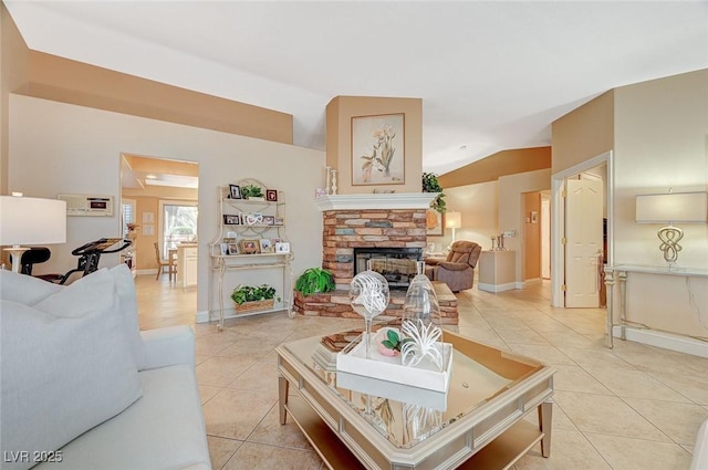 tiled living room with lofted ceiling and a fireplace