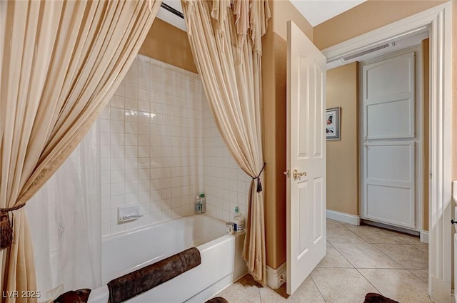 bathroom featuring shower / bath combination with curtain and tile patterned flooring