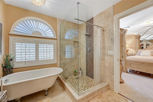 bathroom featuring plus walk in shower and tile patterned flooring