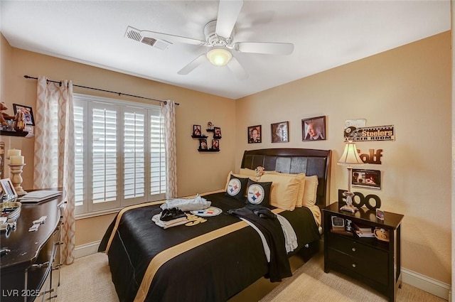 bedroom featuring ceiling fan and light carpet