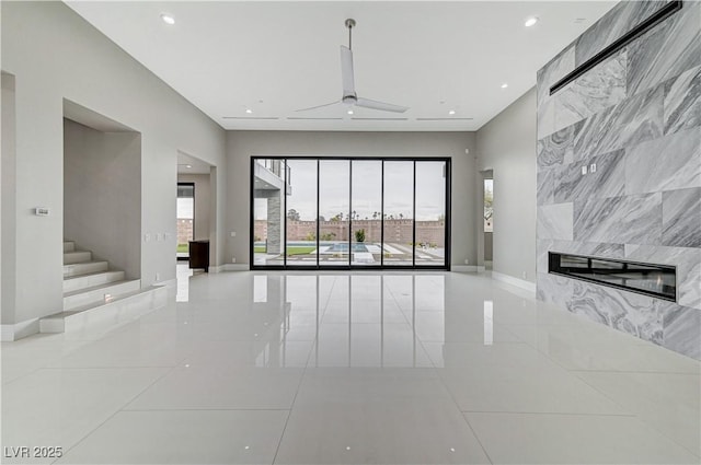 unfurnished living room featuring a high end fireplace