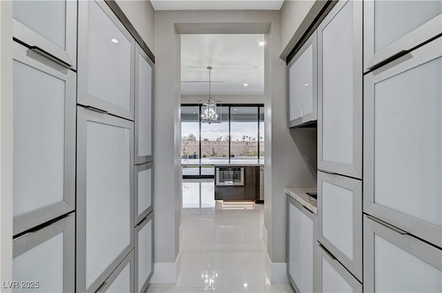 kitchen featuring a chandelier