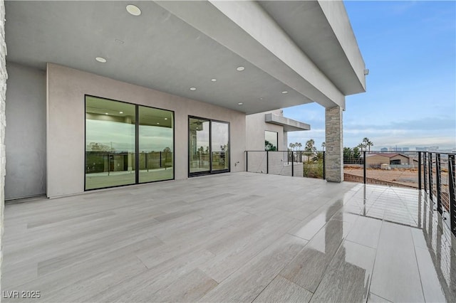 view of patio featuring a balcony