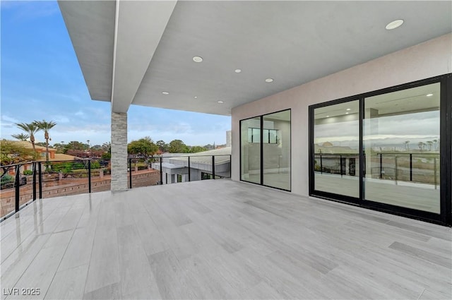 view of patio featuring a balcony