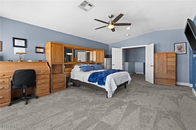 carpeted bedroom featuring lofted ceiling, baseboards, visible vents, and a ceiling fan