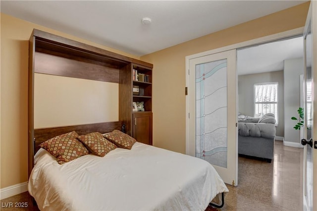 bedroom featuring baseboards