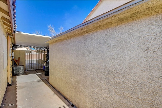 view of side of home with stucco siding