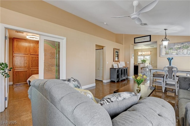 living area with baseboards, visible vents, ceiling fan with notable chandelier, and vaulted ceiling
