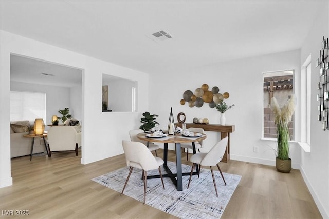 dining room with light wood-type flooring