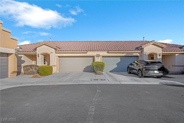 mediterranean / spanish-style home featuring a garage