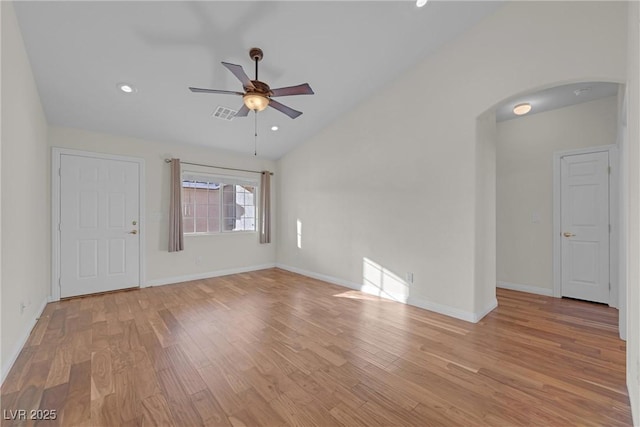 unfurnished room featuring vaulted ceiling, ceiling fan, and light hardwood / wood-style flooring