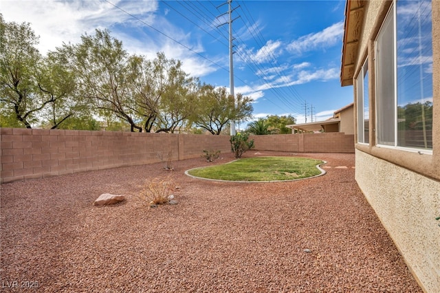 view of yard with a fenced backyard