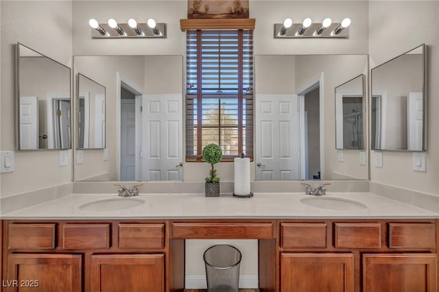 bathroom featuring a sink and double vanity