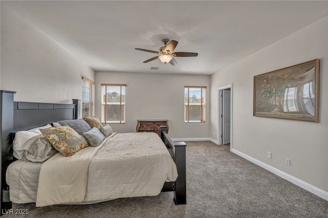 bedroom with baseboards, carpet floors, visible vents, and a ceiling fan