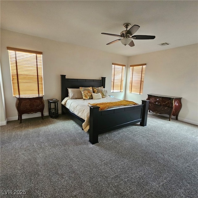 bedroom with a ceiling fan, baseboards, visible vents, and carpet floors