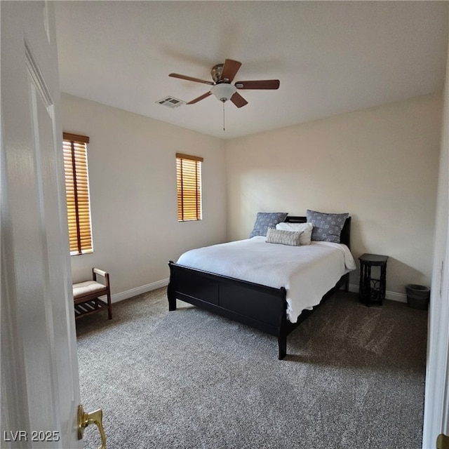 bedroom with visible vents, a ceiling fan, baseboards, and carpet floors