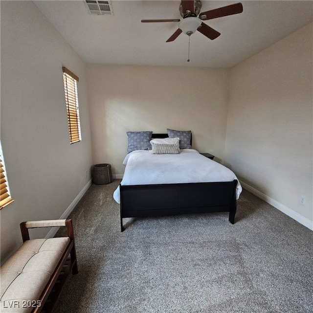 carpeted bedroom featuring a ceiling fan, baseboards, and visible vents