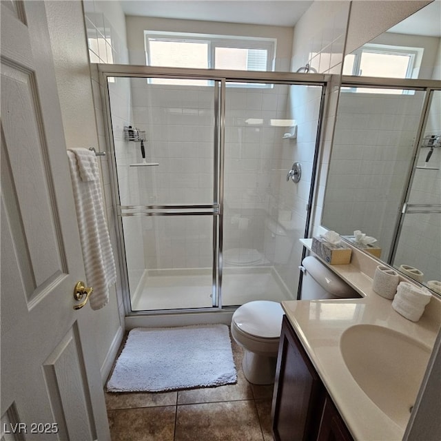 full bath featuring visible vents, toilet, a stall shower, tile patterned flooring, and vanity