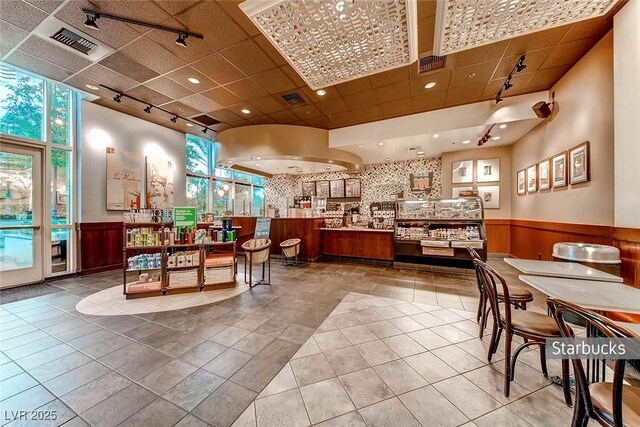 145 E Harmon Ave Unit 2603, Las Vegas, NV 89109 - reception area with wainscoting, a paneled ceiling, and recessed lighting