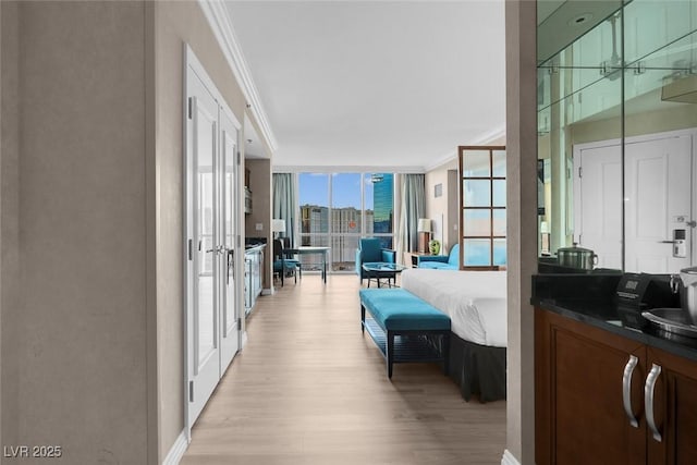 145 E Harmon Ave Unit 2603, Las Vegas, NV 89109 - corridor featuring ornamental molding, light wood-style floors, floor to ceiling windows, and french doors