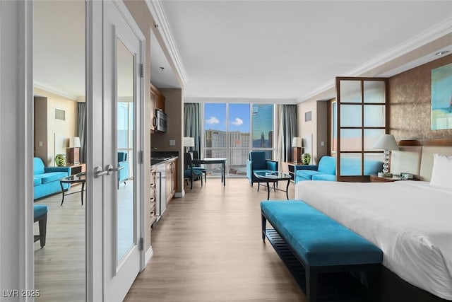 145 E Harmon Ave Unit 2603, Las Vegas, NV 89109 - bedroom featuring ornamental molding, light wood finished floors, french doors, and floor to ceiling windows