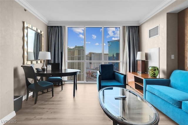 145 E Harmon Ave Unit 2603, Las Vegas, NV 89109 - living area featuring crown molding, a wall of windows, wood finished floors, and baseboards