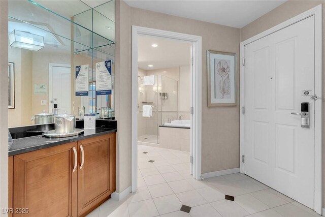 145 E Harmon Ave Unit 2603, Las Vegas, NV 89109 - full bath featuring a stall shower, vanity, tile patterned flooring, and baseboards