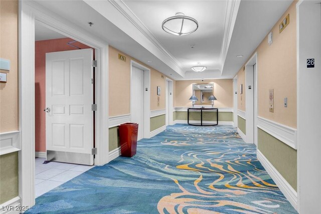 145 E Harmon Ave Unit 2603, Las Vegas, NV 89109 - corridor featuring a raised ceiling, carpet, elevator, crown molding, and tile patterned flooring
