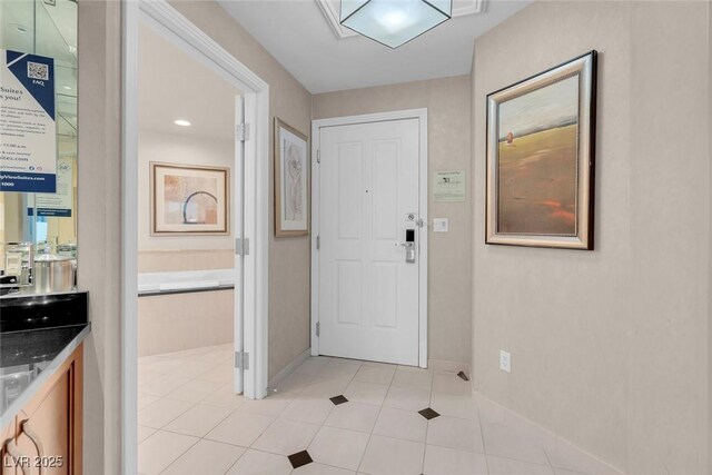 145 E Harmon Ave Unit 2603, Las Vegas, NV 89109 - entrance foyer with baseboards and light tile patterned flooring