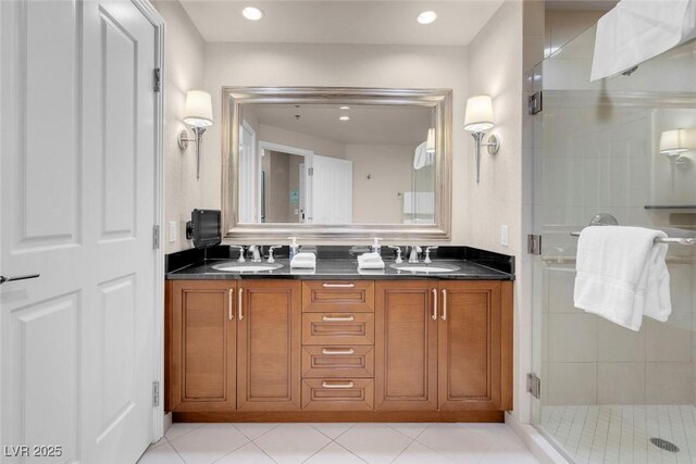 145 E Harmon Ave Unit 2603, Las Vegas, NV 89109 - full bathroom featuring a stall shower, double vanity, recessed lighting, and tile patterned floors