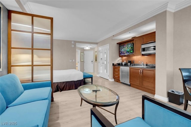 145 E Harmon Ave Unit 2603, Las Vegas, NV 89109 - living room featuring light wood-style floors, crown molding, and baseboards