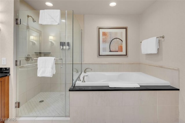 145 E Harmon Ave Unit 2603, Las Vegas, NV 89109 - bathroom featuring a bath, a stall shower, vanity, and recessed lighting