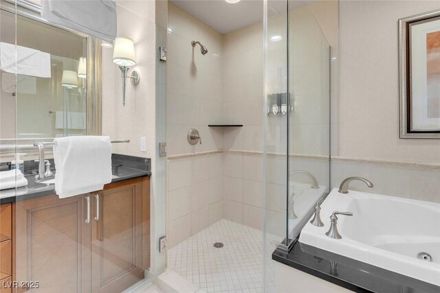145 E Harmon Ave Unit 2603, Las Vegas, NV 89109 - bathroom with a shower stall, a tub with jets, and vanity