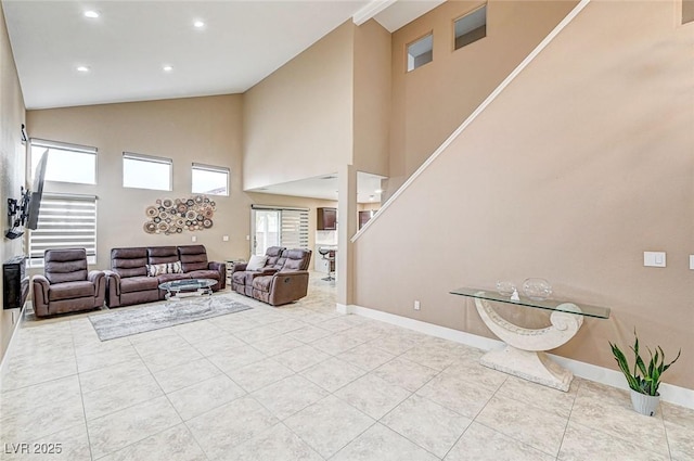 tiled living room with high vaulted ceiling