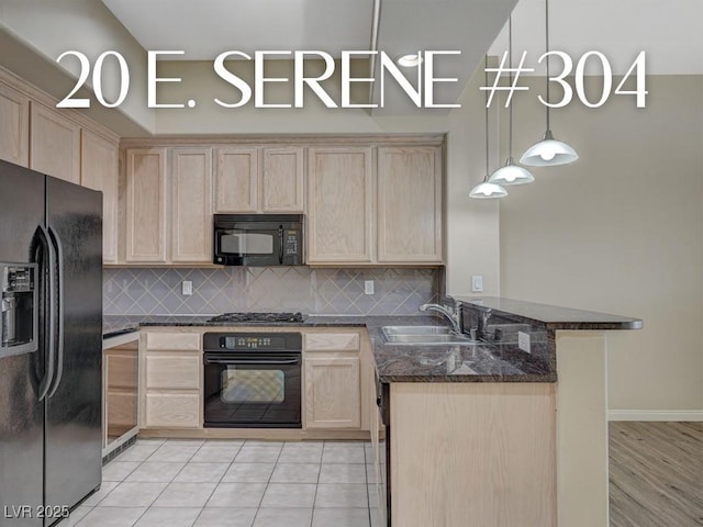 kitchen with sink, decorative light fixtures, black appliances, light brown cabinetry, and kitchen peninsula