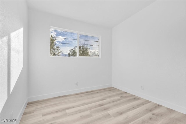 unfurnished room with light wood-type flooring