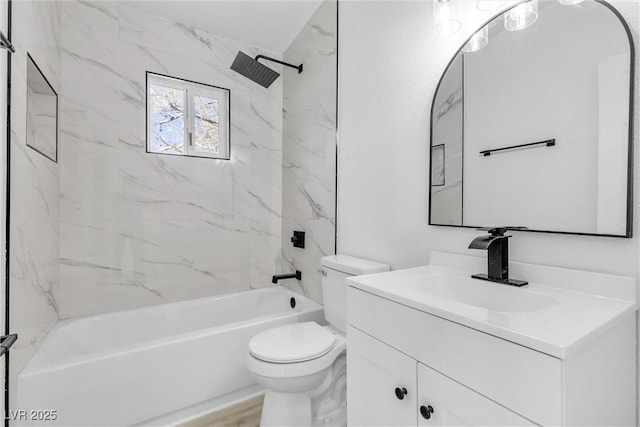 full bathroom featuring vanity, toilet, and tiled shower / bath