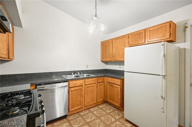 kitchen featuring sink, dishwasher, range with gas stovetop, decorative light fixtures, and white fridge