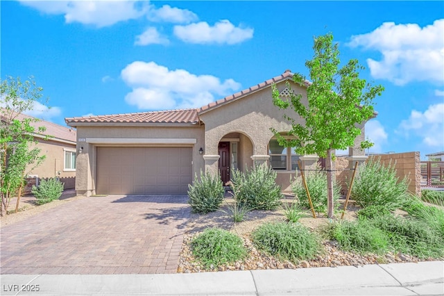 mediterranean / spanish-style house featuring a garage