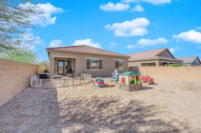 back of house with a patio area