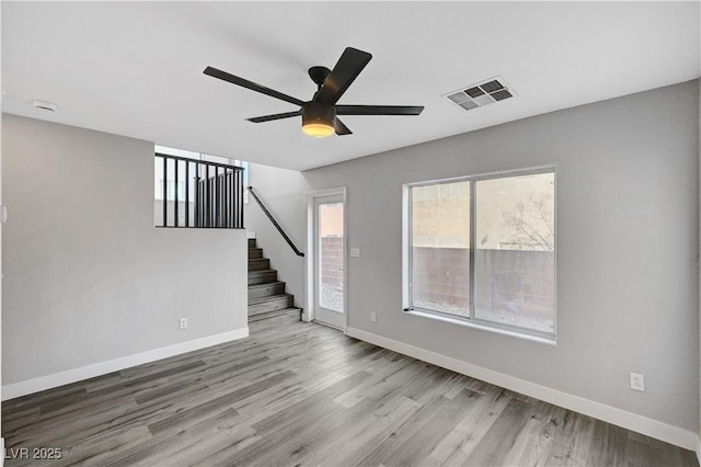 unfurnished room featuring ceiling fan and light wood-type flooring