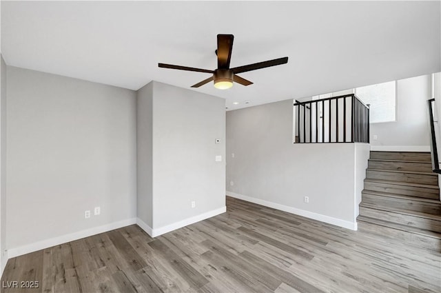 spare room with light hardwood / wood-style floors and ceiling fan